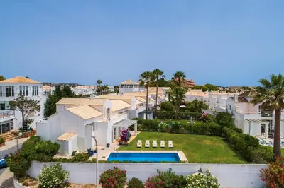 an aerial view of a villa with a swimming pool and buildings at Villa Farol by OCvillas in Galé