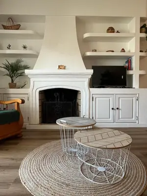 a living room with a coffee table and a fireplace at Apartamento Diago in Albufeira