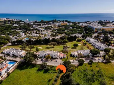 an aerial view of a resort with an orange arrow pointing to a suburb at #120 T3 Espaçoso em Albufeira by Home Holidays in Albufeira