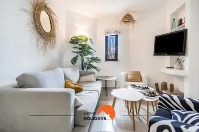 a living room with a couch and a table at #120 T3 Espaçoso em Albufeira by Home Holidays in Albufeira