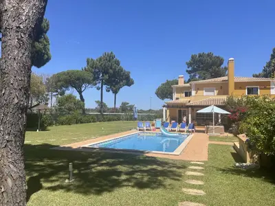 a house with a swimming pool in a yard at Vila Caravela - Private Pool by HD Properties in Vilamoura