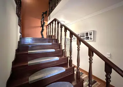 a staircase with wooden railings in a home at Vila Caravela - Private Pool by HD Properties in Vilamoura