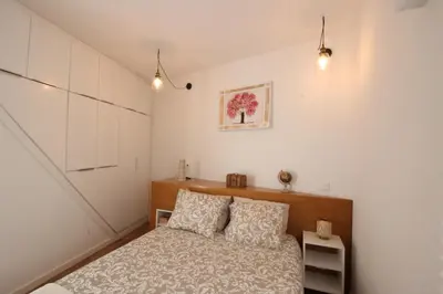 a bedroom with a bed and two pillows at Downtown Villa in Faro