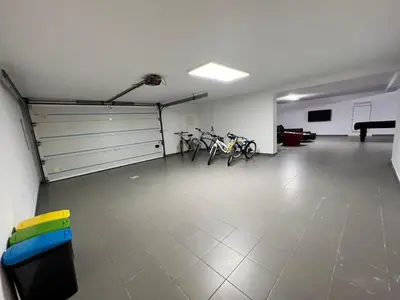 a garage with several bikes parked in it at Villa Pedra Luxe - Spacious modern villa in Albufeira