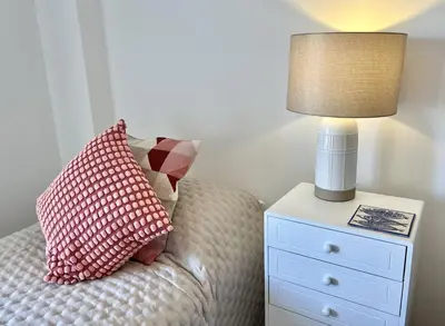 a bedroom with a bed with a lamp and a nightstand at Vista by the Nest - City Center HD PROPERTIES in Faro