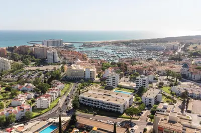 an aerial view of a city with the ocean at CORTEZ - Vilamoura in Vilamoura