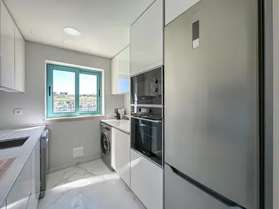 a kitchen with white appliances and a window at Luxury 1 Bedroom Apartment, Marina de Albufeira3 in Albufeira