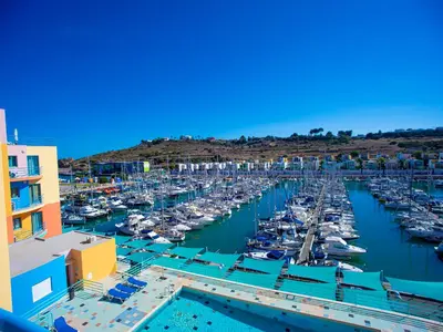 a marina filled with lots of boats in the water at Luxury 1 Bedroom Apartment, Marina de Albufeira3 in Albufeira
