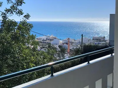 a view of the ocean from a balcony at Sunset Bliss in Albufeira - Short walk to Oldtown in Albufeira