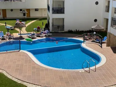 a swimming pool in the middle of a building at Sunset Bliss in Albufeira - Short walk to Oldtown in Albufeira