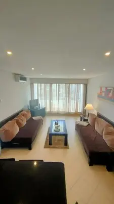 a living room with two couches and a coffee table at Vilamoura Apartamento Algarve 311 in Vilamoura