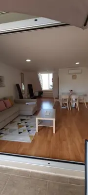 a living room with a couch and a table at Star Dreams Albufeira in Albufeira