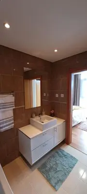 a bathroom with a sink and a mirror at Star Dreams Albufeira in Albufeira