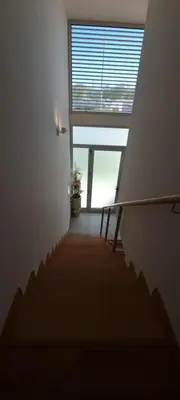 a stairway with a large window in a room at Star Dreams Albufeira in Albufeira