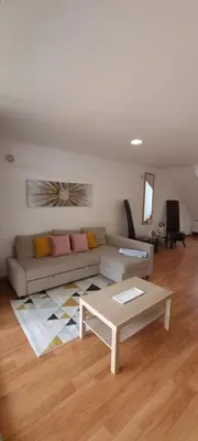 a living room with a couch and a coffee table at Star Dreams Albufeira in Albufeira