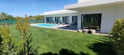 a house with a yard with a swimming pool at Valverde 3 Villa, Vilamoura, Algarve, only 5 minutes from Marina, Golf and Beach in Quarteira
