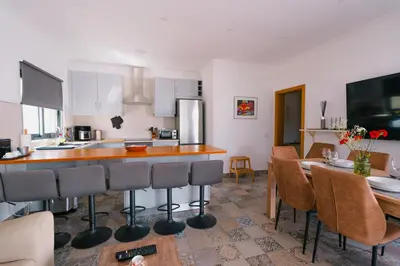 a bedroom with two beds and a mirror on the wall at Casas Caiado Two Houses with swimming POOL in Faro