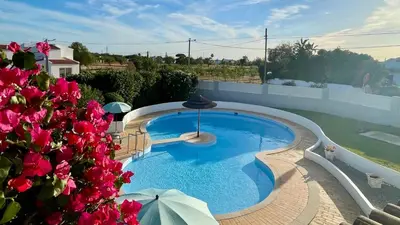 a swimming pool on the roof of a house at Nicola by Check-in Portugal in Albufeira