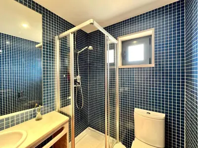 a bedroom with a bed and a bath room at Albufeira Experience With Pool by Homing in Albufeira