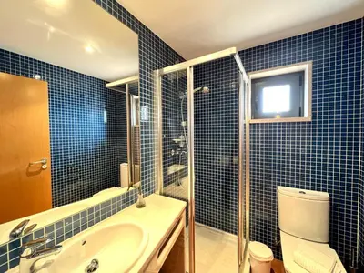 a bedroom with a large bed with a pink blanket at Albufeira Experience With Pool by Homing in Albufeira