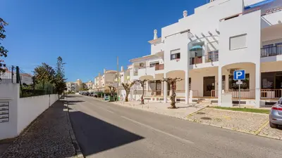 an empty street in a town with white buildings at Sun-kissed Oasis W/ Pool by LovelyStay in Albufeira