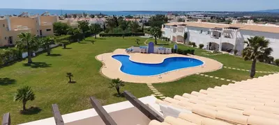 an aerial view of a large swimming pool in a yard at Baia Village - Galé - Albufeira in Albufeira