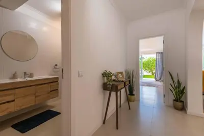 a bathroom with a sink and a mirror at Lemon House - 400m from the Beach - Wifi in Albufeira