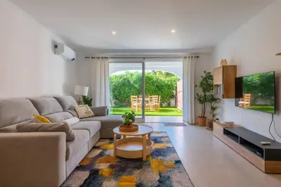 a living room with a couch and a table at Lemon House - 400m from the Beach - Wifi in Albufeira