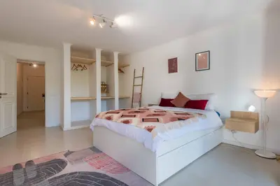 a white bedroom with a large bed in a room at Lemon House - 400m from the Beach - Wifi in Albufeira