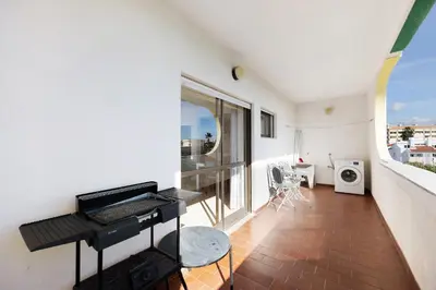 an apartment balcony with a view of the ocean at House Amendoeiras in Vilamoura