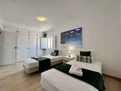 a room with two beds in a room at Vilamoura Central 5 by Homing in Vilamoura