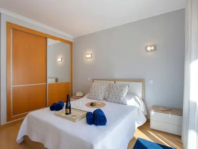 a bedroom with a bed with blue towels on it at Villa Mathilda by Interhome in Albufeira