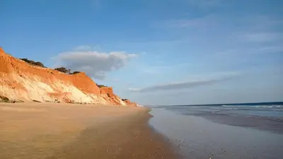 a sandy beach with a view of the ocean at Your house at Falésia in Albufeira