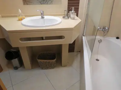 a bathroom with a sink and a shower at Apartamento - CERRO MAR in Albufeira