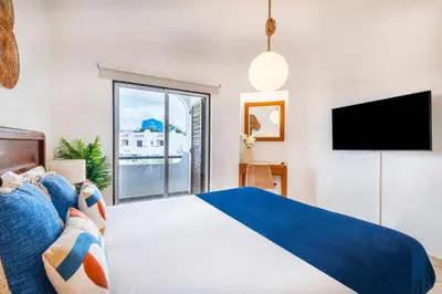 a bathroom with a sink and a tub and a mirror at Clube Albufeira: 2BR Prime Holidays Retreat in Albufeira