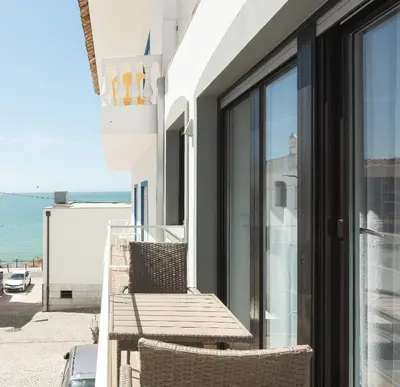 a balcony with chairs and a view of the ocean at Miral Beachside 3 - by HD Properties in Albufeira