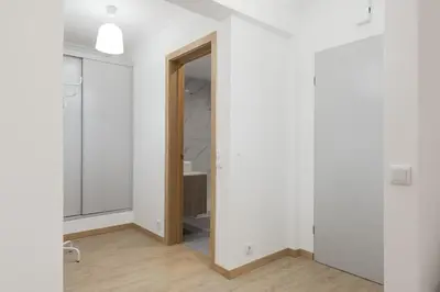 an empty room with white walls and a mirror at Miral Beachside 4 - by HD Properties in Albufeira