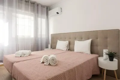 a bedroom with two towels on a bed at Miral Beachside 2 - by HD Properties in Albufeira