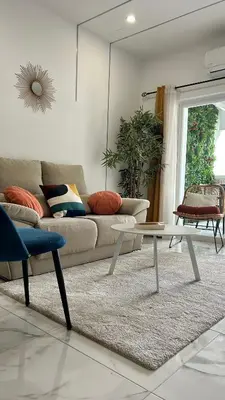 a living room with a couch and a table at Dubai Apartment in Albufeira