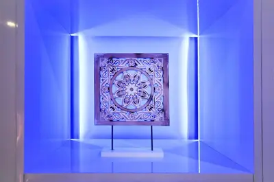 a painting on display in a blue room at Dubai Apartment in Albufeira