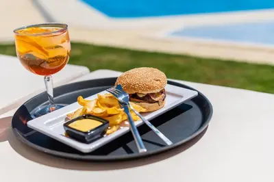 a buffet with different types of food on a table at Emeralds Albufeira by DK Stays in Albufeira