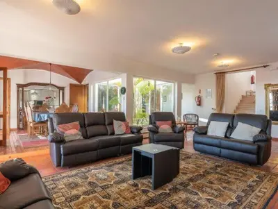 a living room with leather couches and a table at Villa Savannah - Close to fisherman beach in Albufeira