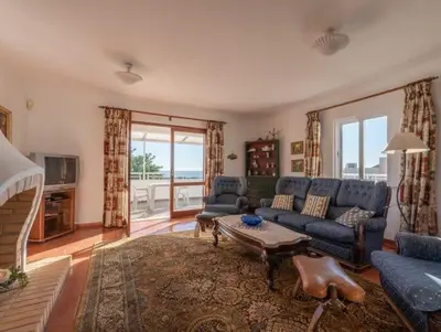 a living room with a couch and a table at Villa Savannah - Close to fisherman beach in Albufeira