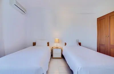 an image of a swimming pool in front of a building at Melvin Jones St. 2bedroom apartment in Quarteira