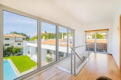 a view from the living room of a house with large windows at Villa L in Galé