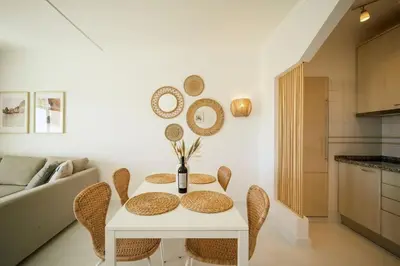 a white table and chairs in a living room at Casa Dos Reis - Albufeira, Center in Albufeira
