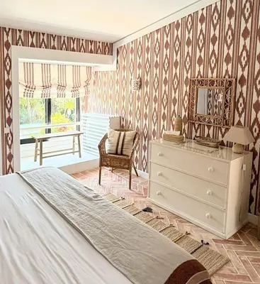 a bedroom with a bed and a dresser and a chair at Quinta do Lago, Victory Village N 63 in Almancil