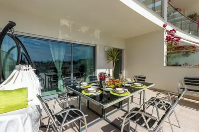 a dining room with a table and chairs at Villa Seashell in Albufeira