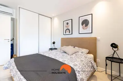 two white vases sitting on top of a wooden table at #126 T1 Vale Mangude 213 by Home Holidays in Albufeira