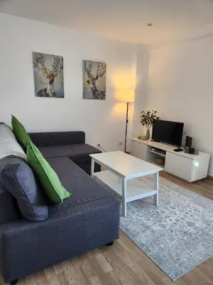 a living room with a couch and a table at GrowIN Stay Downtown in Faro